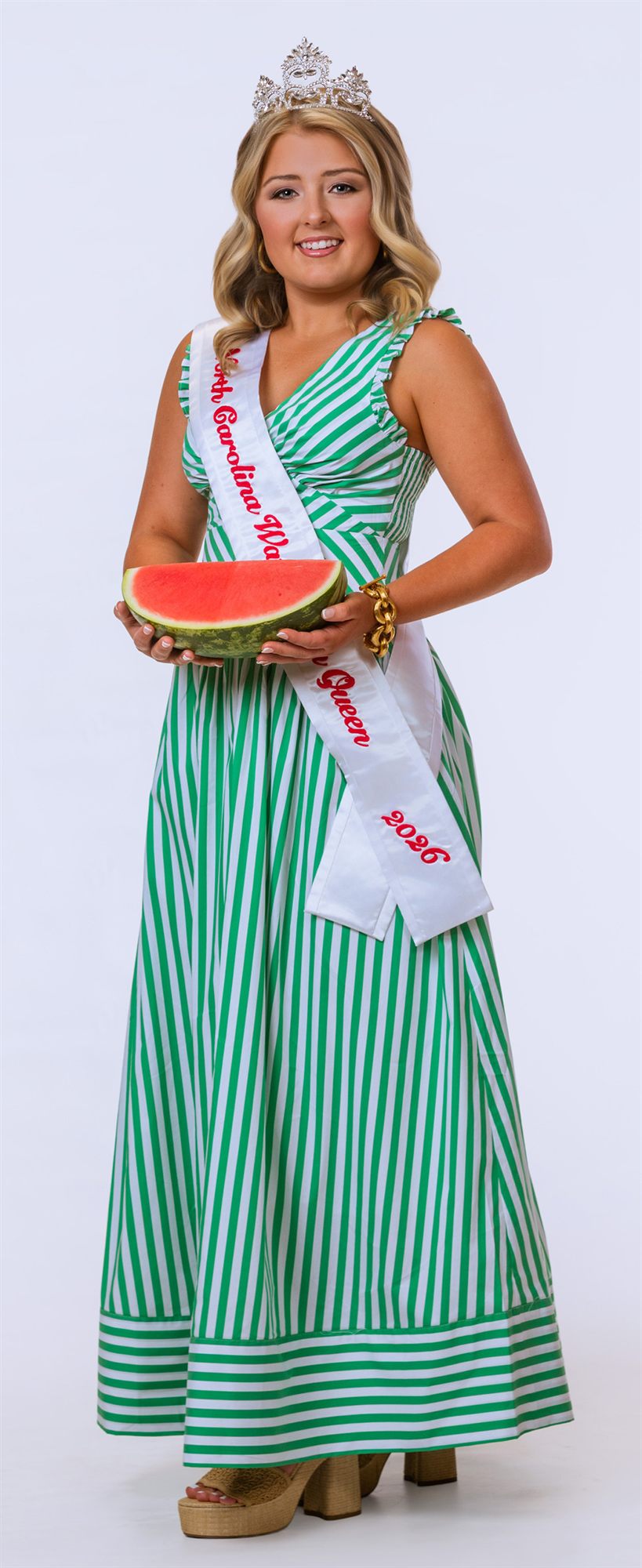 Lilah Byrum carrying a tray of cut watermelon at a road race