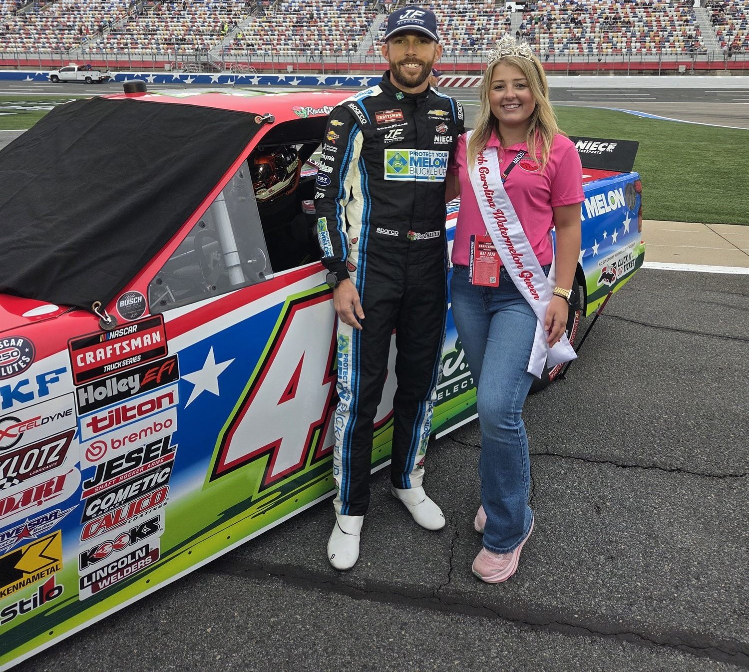 Lilah Byrum with the watermelon-liveried race truck at Charlotte Motor Speedway